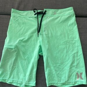 Turquoise neon green Hurley board shorts